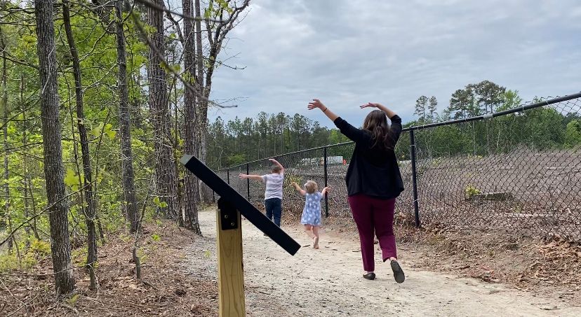 The story walk gives fun, zany tasks for families to complete together, making reading fun. (Spectrum News 1/Natalie Mooney)